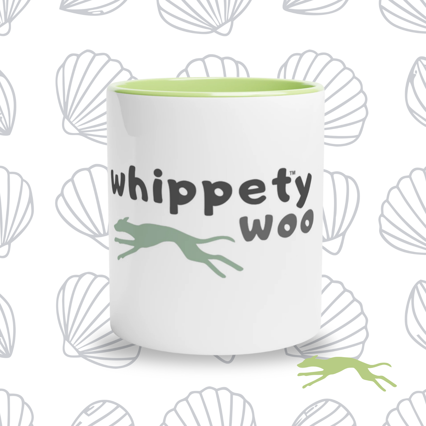 White with green mug with 'whippety woo' text and whippet shape on a shell-themed background